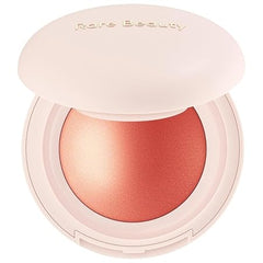 Rare Beauty by Selena Gomez Soft Pinch Luminous Powder Blush in the shade Joy (a muted peach color)